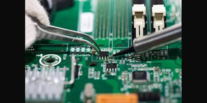Circuit board being reworked at a repair station at Comtec Labs